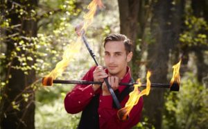 Elliot the Entertainer with fire sticks